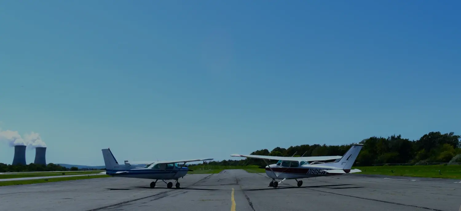 Two planes at Pitcairn Flight Academy