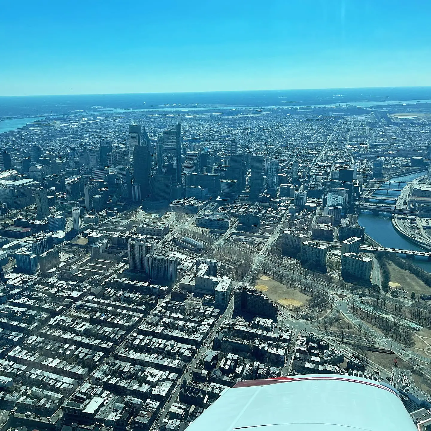 Cards and plane with Philadelphia city view from plane during day at Pitcairn Flight Academy in Philadelphia, PA