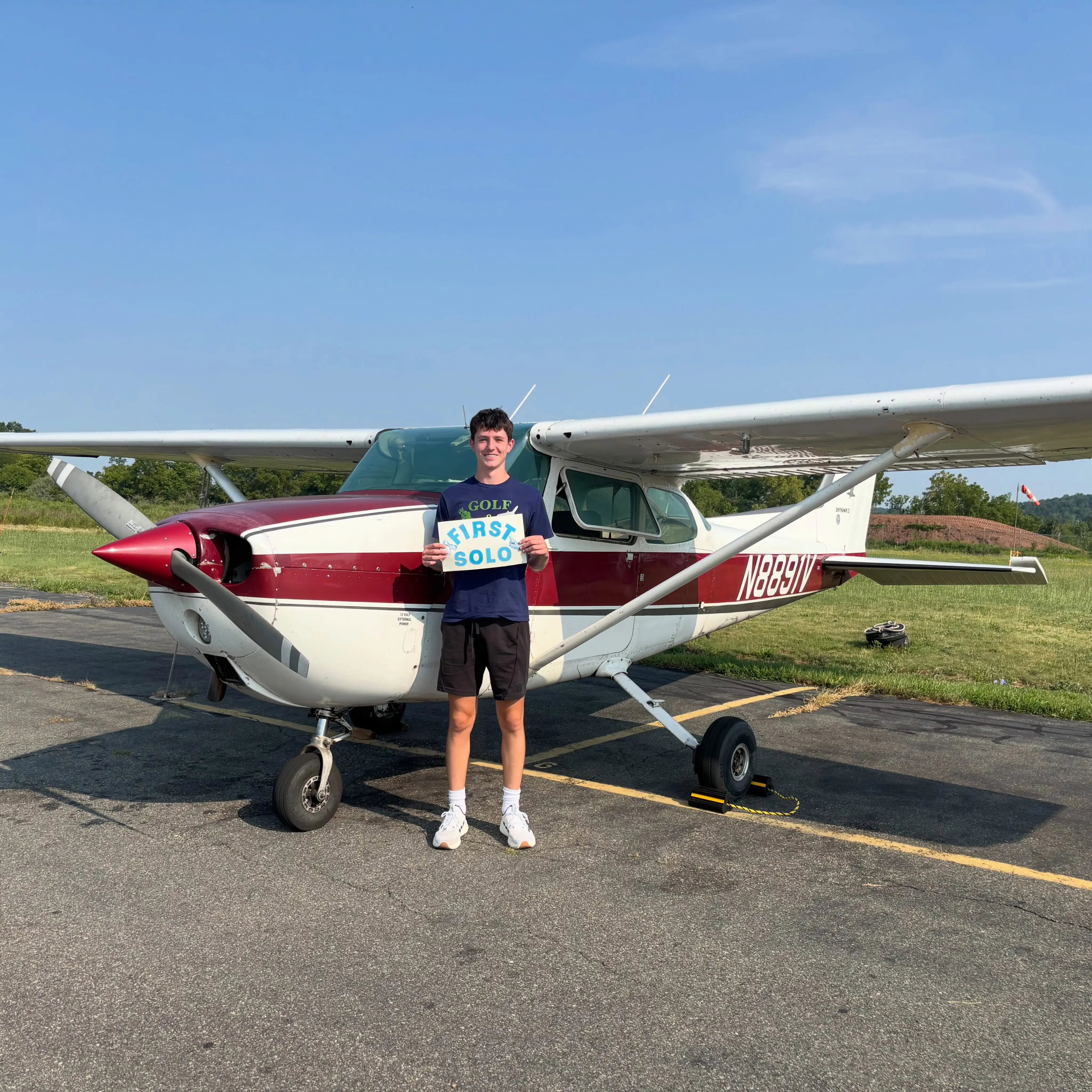 Student smiling beside the aircraft during the preflight walk around before a discovery flight at Pitcairn Flight Academy